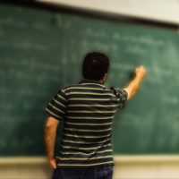 Teacher at chalkboard